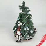Маленькое фото 3: Новогодняя композиция «Ёлка (пихта) с Дедом Морозом», D 35 см x H 65 см