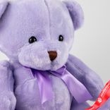 Маленькое фото 3: Игрушка м/н «Медведь с бантом», 25см, светло-сиреневый