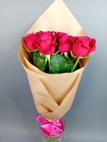 Фото флориста 1: Букет из 11 красных роз в крафте