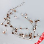 Маленькое фото 1: Гирлянда с шишками заснеженная, 130см, коричневый