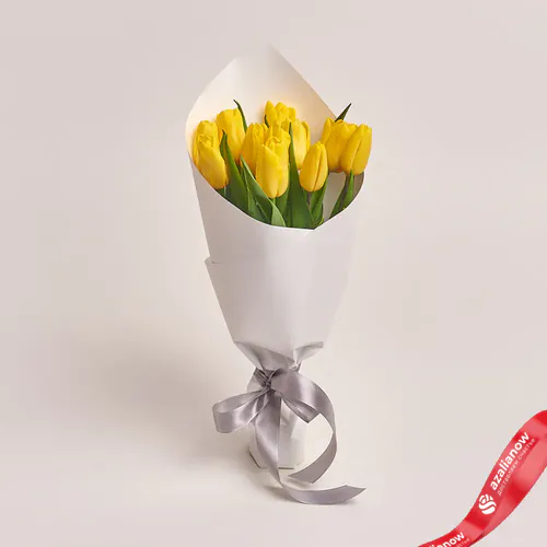 Фото 1: Букет из 11 желтых тюльпанов в белой бумаге «Прилежный ученик». Сервис доставки цветов AzaliaNow
